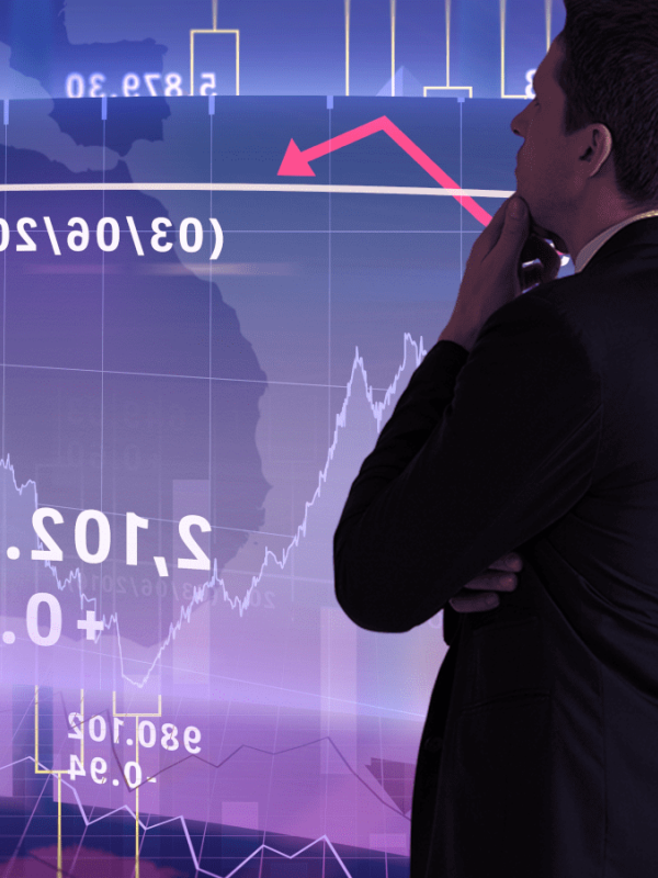 Businessman studies stock prices